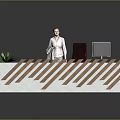 Modern Unique Office Desk With White Base Brown Slanted Stripes Black Chair Monitor And Green Plant