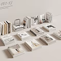 Stacked Books and Magazines with Various Cover Designs on Neutral Background