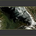 3D Terrain Model With Wooden Base And Mountainous Landscape Green Vegetation White Peaks