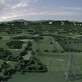Expansive Green Countryside Scenery With Lush Fields Trees And Snow Capped Mountains Under Cloudy Sky