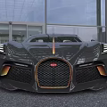 Black Luxury Sports Car With Gold Accents And Sleek Aerodynamic Design