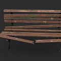 Worn Outdoor Bench With Damaged Wooden Planks Metal Legs And Green Graffiti
