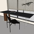 Modern Black Table and Chair Set with Books on Table Near Window Blinds and Plant