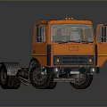 Orange Truck Chassis With Cab And Large Wheels On Dark Background
