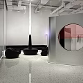 Modern Clothing Store Interior With Arched Mirrored Doorways And Stylish Display Lighting