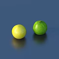 Two Fresh Yellow and Green Round Fruits Displayed on Blue Background