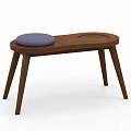 Wooden Stool With Blue Padded Seat And Circular Tray On Three Legs