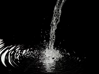 Garden Water Feature With Flowing Water Creating Ripples And Splashes Against Black Background 3d model
