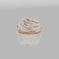 Delicious Vanilla Cupcake With Swirled Cream Frosting And Red Drizzle In Paper Liner