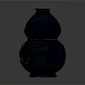 Black Gourd Shaped Carved Sculpture With Golden Intricate Patterns And Smooth Surface
