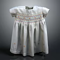 White Dress With Short Sleeves Colorful Neckline Embroidery Pleated Skirt And Star Patterns On Hem