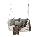 Cozy Wicker Hanging Chair With Gray Cushions And Brown Throw Blanket Design