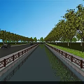 Scenic Road With Central Canal Lined By Trees And Green Grass Under Blue Sky
