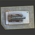 Ancient Cannon Weapon Display With Green Barrel On Wooden Carriage Placed On Stone Slab Ground