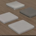 Soft Square Floor Cushions In Light And Dark Gray Tones On Wooden Surface