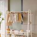 White Metal Clothes Rack Hanging Light Colored Garments With Lower Shelf Storage In Modern Interior
