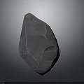 Natural Rock Formation With Irregular Shape And Pitted Textured Surface Against Dark Background