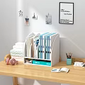 Folders in White Desktop Organizer with Blue and White Files on Wooden Desk and Stationery