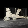 Artistic Floral Art Installation With White Flowers Geometric Drapery And Black Backdrop