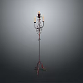 Ornate Floor Candelabra With Metal Scroll Design And Multiple Candle Holders