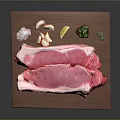 Fresh Raw Steak on Wooden Cutting Board with Garlic Cloves Lemon Slice and Herbs