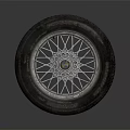 Automotive Tire with Wheel Rim Detailed Spoke Design and Tread Pattern on Gray Background