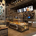 Modern Bubble Tea Shop Interior With Hexagonal Decor Display Shelves And Menu Boards
