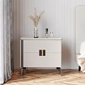 White Bedside Table with Gold Handles and Dried Grass Decor on Striped Wall Wooden Floor
