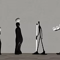 Abstract Metal Sculptures With Balancing Balls And Standing Figures In Modern Interior