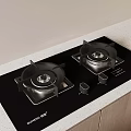 Modern Black Gas Stove with Two Burners on Light Countertop and Wooden Cabinets