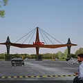 Modern Entrance Gate Design With Logo Sign And Parking Area For Vehicles And Pedestrians