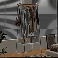 Modern White Clothes Rack with Hanging Clothes Pink Bag and Storage Boxes in Interior
