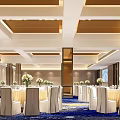 Elegant Modern Banquet Hall With Well Arranged Tables Chairs And Floral Centerpieces
