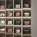 Elegant Handbags Display On Illuminated Shelves With Various Styles And Colors