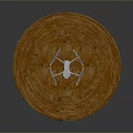 White Drone Placed On Brown Circular Stepped Structure With Layered Design