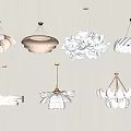 Various Petal Shaped White Chandeliers With Layered Designs And Gold Metal Accents