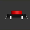 Red Circular Button With Black Base And Metal Pins As Essential Household Electronic Item