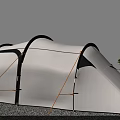 White Tent Featuring Black Curved Structure Yellow Ropes Securing On Gravel Ground Near Green Trees