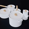 White Cookware Set with Wooden Handles and Knobs in Various Sizes