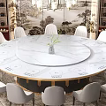Banquet Hall With Round Marble Dining Table White Chairs Decorative Wall Painting Carpet And Green Plant