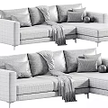 Modern L Shaped Upholstered Sofa in Neutral Tones With Throw Blanket Decorative Pillows and Balls