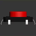 Red Circular Button With Black Base And Metal Pins As Essential Household Electronic Item