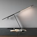 Modern Adjustable Desk Lamp With Sleek Pole And Open Book On Dark Desk