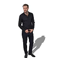 Man In Black Shirt And Dark Pants Standing With Hands In Pockets On White Background