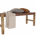 Cozy Wooden Bench with Woven Seat Light Colored Blanket Gray Brown Pillows