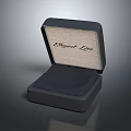 Display Shelves Showcasing Open Black Box With Light Colored Lining And Elegant Line Text