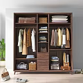 Dark Wooden Wardrobe With Hanging Clothes Folded Linen Baskets And Storage Drawers