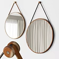 Round Mirrors with Wooden Frames and Leather Hanging Straps Hanging on Wall Against White Curtain