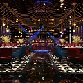 Elegant Bar Interior Design With Colorful Seating Chandeliers Wine Racks And Decorative Ceiling