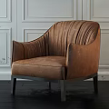 Brown Velvet Single Sofa With Vertical Stripes Curved Backrest Metal Legs Against White Paneled Wall